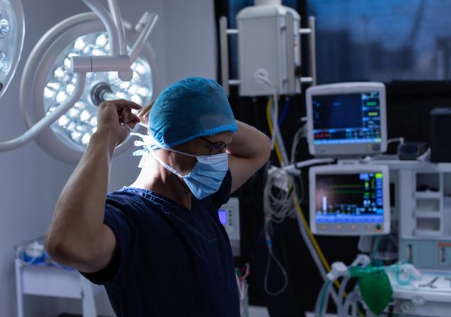 Hospital health workers preps for surgery. Image by wavebreakmedia via Shutterstock