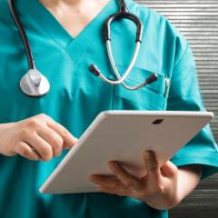 Real-world data and evidence can be found in places such as patients' electronic health records. Image © park deok 1495, Shutterstock. A doctor checks a patient's electronic health record, a source of real-world evidence and data