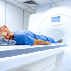 Image by Aleksandar Malivuk via Shutterstock An elderly man who is about to have an MRI scan. He has white hair and a beard and is wearing what looks like blue, hospital issue pyjamas.  Image by Aleksandar Malivuk via Shutterstock